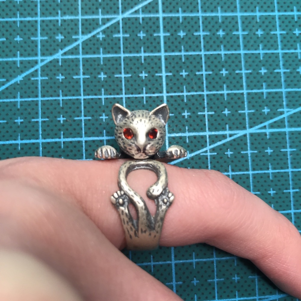 silver adjustable cat ring with red rhinestone
